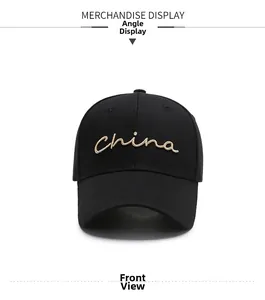 Detailed close-up of golden China embroidery on black cotton baseball cap with air vents