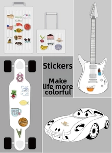 Close-up of VSCO aesthetic stickers on a suitcase, laptop, and guitar accessories