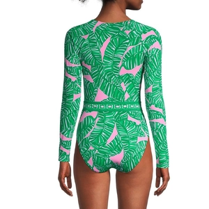 Rear view of long sleeve one-piece swimsuit with pink and green palm leaf print patterns