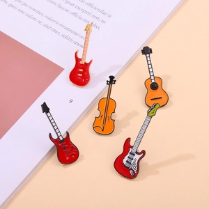 Set of 5 enamel musical instrument brooches featuring red guitars and orange violin