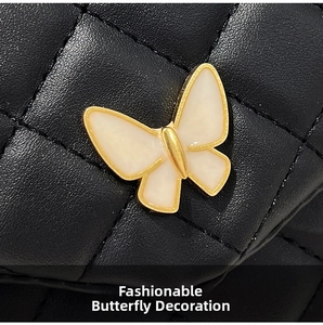 Close-up of golden butterfly ornament with white inlay on black quilted crossbody bag