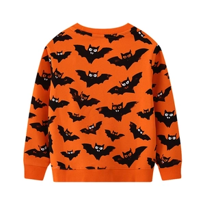 Detail of orange kids sweatshirt with black bat patterns and ribbed cuffs for Halloween
