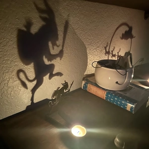 Metal shadow candle holder silhouette casting a scary figure on wall for Halloween decor