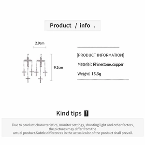 Detail view of crystal cross earrings with precise measurements and material info