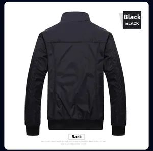 Rear view of black waterproof outdoor jacket showing shoulder seams and ribbed hem details