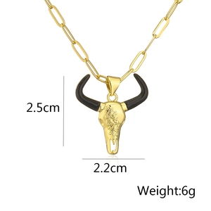 Detail view of 18K gold plated bull skull pendant showing dimensions 2.5cm by 2.2cm and 6g weight