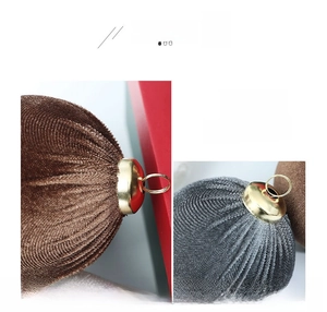 Detail of velvet Christmas ball ornaments with pleated texture and gold metal caps