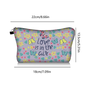 Dimensions of butterfly print makeup bag with Love is in the air text and zipper detail