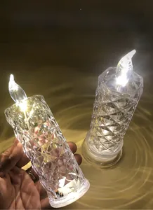 Macro view of crystal acrylic rose candle lamp with diamond cut texture and warm led flame