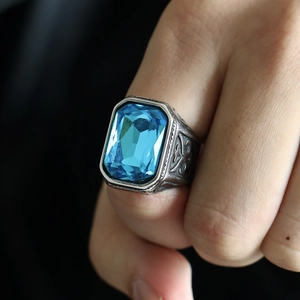 Stainless steel ring with large rectangular blue gemstone and engraved silver band