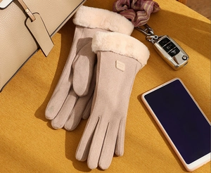 Close-up of beige thermal suede gloves with plush faux fur trim and touch screen tips