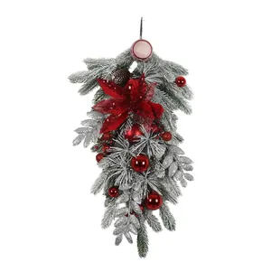 Christmas teardrop swag with frosted pine needles, red poinsettia and ornaments
