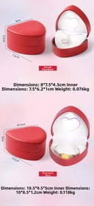 Macro view of red heart jewelry boxes with LED lights and plush white velvet lining