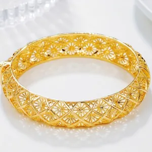 Detail view of gold hollow engraved bangle showing 6cm inner diameter and 1.4cm width