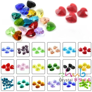 Macro detail of 10mm and 14mm heart shaped crystal beads in 20 assorted colors