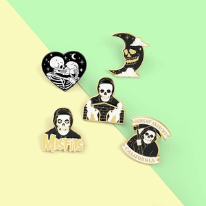 Gothic enamel pin set featuring heart skulls, moon reaper, and rock band motifs