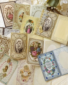 Close-up of 20 retro art cards featuring religious icons, flowers, and vintage lace details