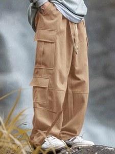 Men's loose straight cargo pants in khaki with multiple pockets for outdoor hiking