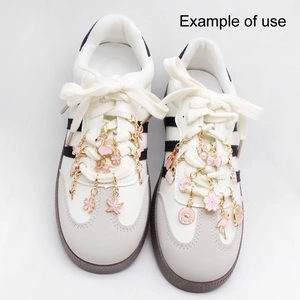 Pink flamingo and flower charms on a gold metal chain for sneaker shoe decoration