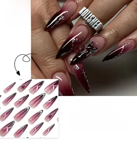 Macro detail of long stiletto press-on nails with dark red gradient and silver fluid art