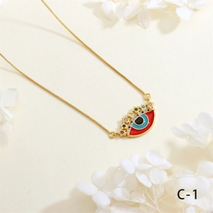 Macro detail of Evil Eye necklace with colored enamel inlay and zircon accents