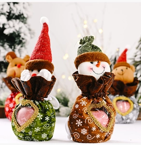 Christmas gift bags with Santa and snowman designs featuring a transparent heart window