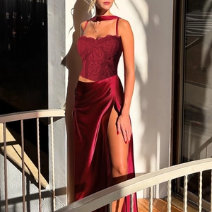 Elegant red lace corset top and high-slit satin maxi dress for formal evening wear