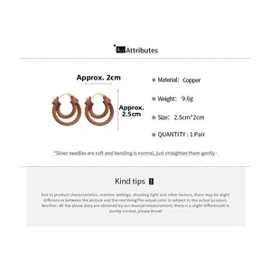 Detailed view of 18k gold plated double round pendant earrings showing 2.5cm size and weight