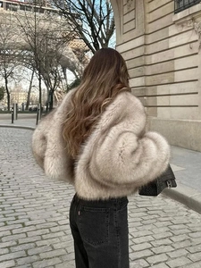 Faux fur jacket with plush collar in taupe grey paired with jeans and Eiffel Tower backdrop