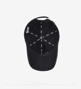 Detail view of cotton baseball cap interior with reinforced lettered taping and adjustable buckle