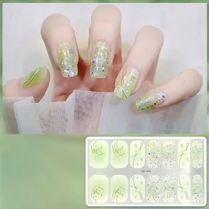 Detail view of CS-410 Morandi green nail stickers with glitter and floral patterns