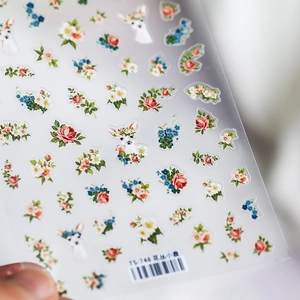Self-adhesive nail sticker featuring floral patterns and deer icons on metallic backing
