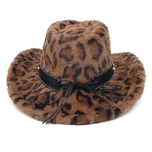 Macro detail of plush leopard print faux fur texture on a western cowboy style hat