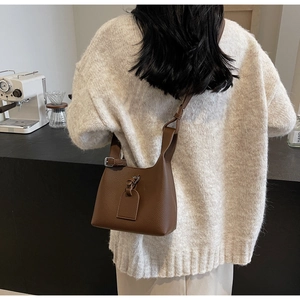Vintage brown lychee grain leather bucket bag for women with adjustable shoulder strap