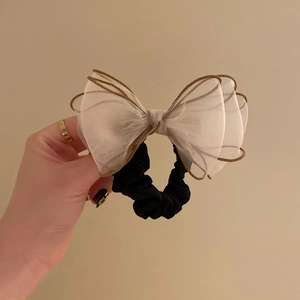 Elegant organza oversized scrunchie with beige bow and gold trim for bun hairstyles