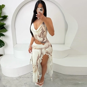 Sultry marble print asymmetric dress with halter neck, waist cutout and ruffled hemline