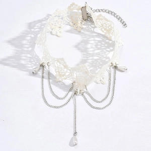 Elegant white lace choker with triple silver chains and pearl pendants on white background