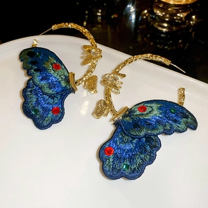 Elegant floral earrings with blue-green embroidered butterfly wings and gold details
