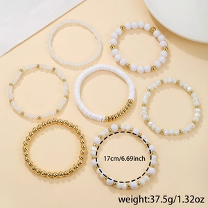 Set of 7 white and gold acrylic crystal beaded stretch bracelets for women, 17cm length