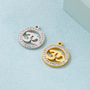 Om symbol pendants with sparkling rhinestones in silver and gold stainless steel finishes