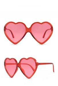 Front and 45-degree angle view of pink heart-shaped jelly frame sunglasses with red lenses