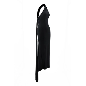 Detail view of black one-shoulder dress with side draping ribbon on white background