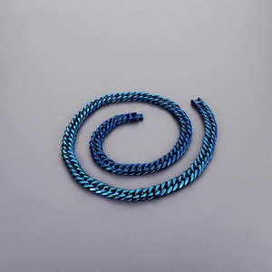 Detailed top view of a spiral blue plated stainless steel cuban curb chain necklace