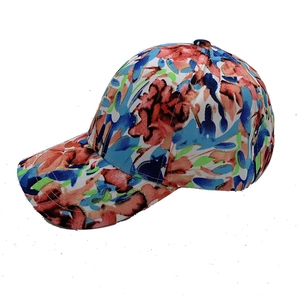 Detailed view of the abstract floral pattern on this colorful canvas baseball cap