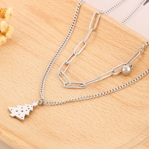Detailed view of silver stainless steel double-layer Christmas tree necklace and chain set