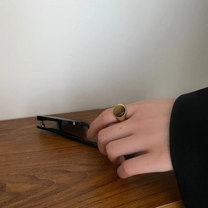 Vintage gold S925 sterling silver signet ring with round tiger eye stone worn on hand