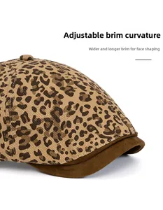 Close-up of leopard print beret featuring foldable dark brown suede brim for face framing