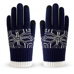 Detail view of navy blue winter touchscreen gloves with white geometric knit patterns