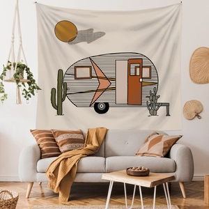 Retro camper van wall tapestry with cactus design in a cozy bohemian living room setup