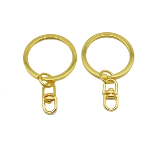 Golden DIY keychain set with round split rings and swivel lobster clasps on white background